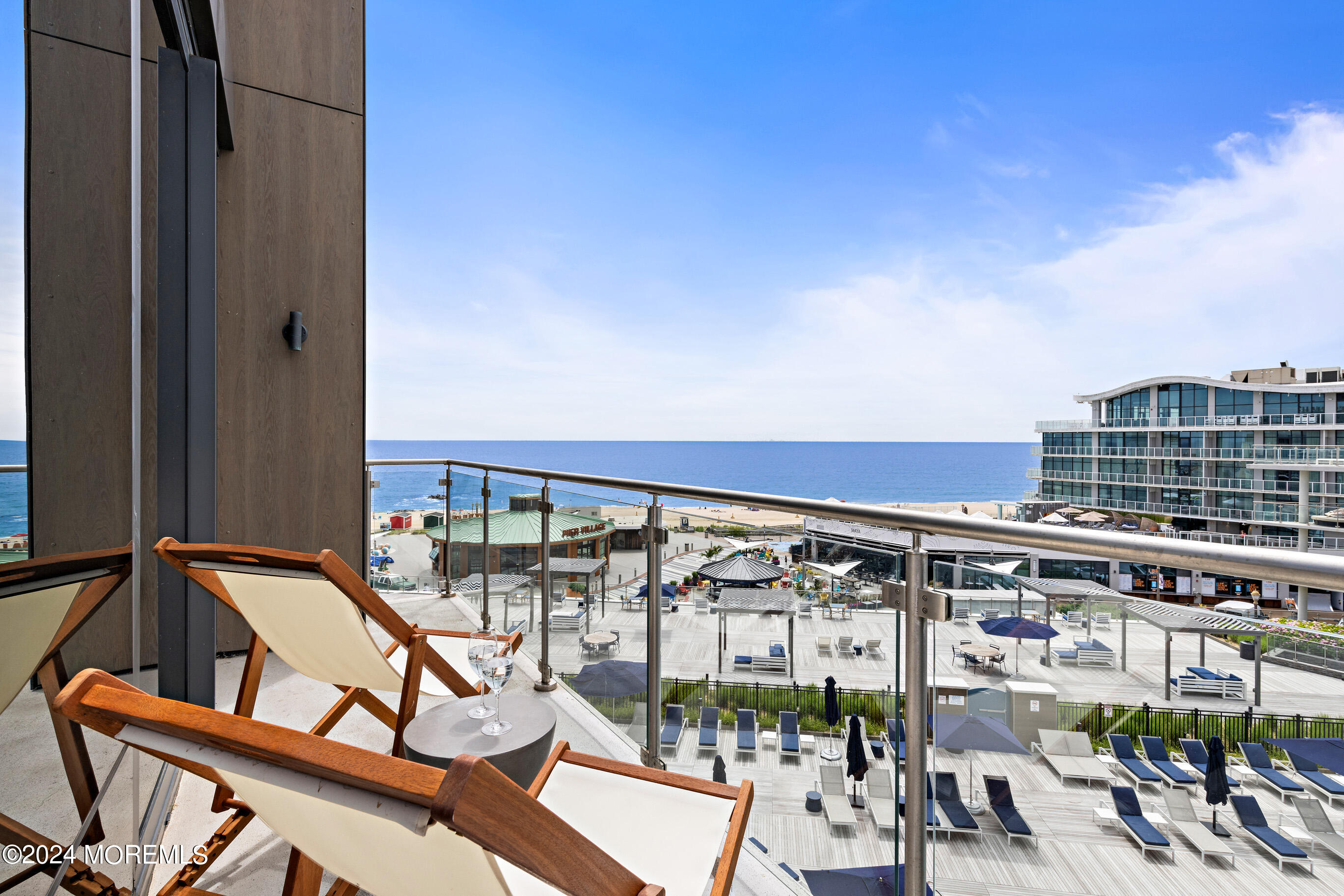 a view of a balcony with chairs