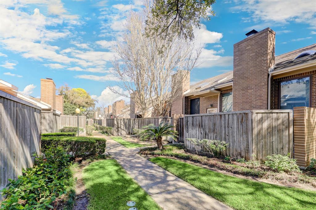 Welcome to 13804 Hollowgreen Drive! This stunning townhouse is situated in the serene & beautiful community of Westhollow Villa.