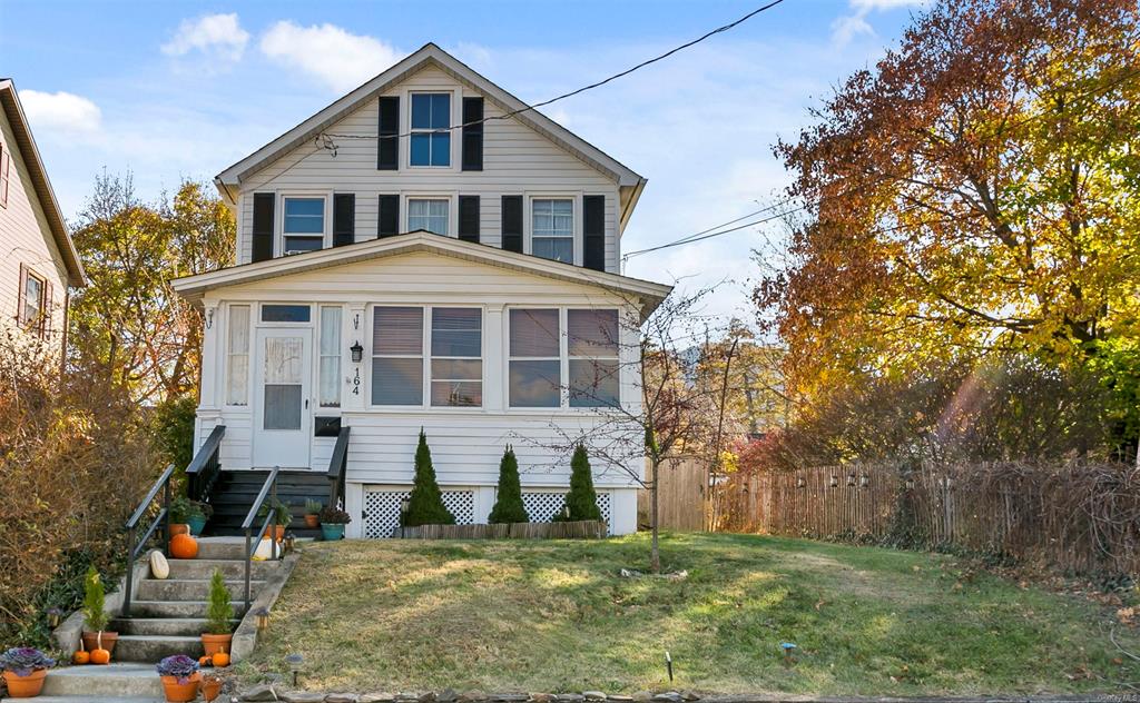 View of front of house with a front yard