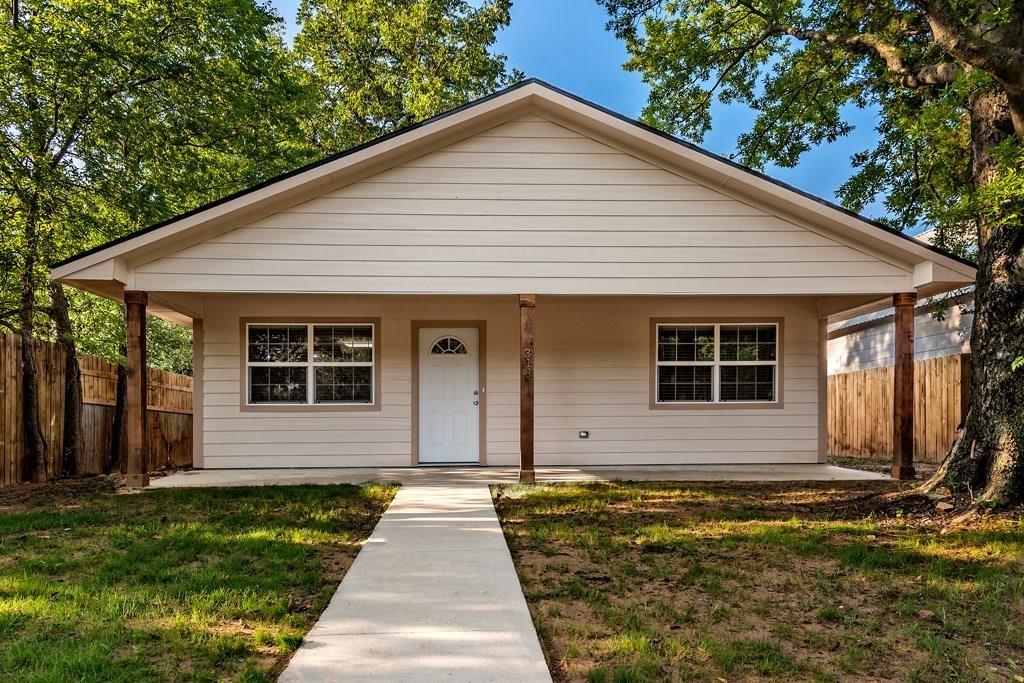 a front view of a house with yard