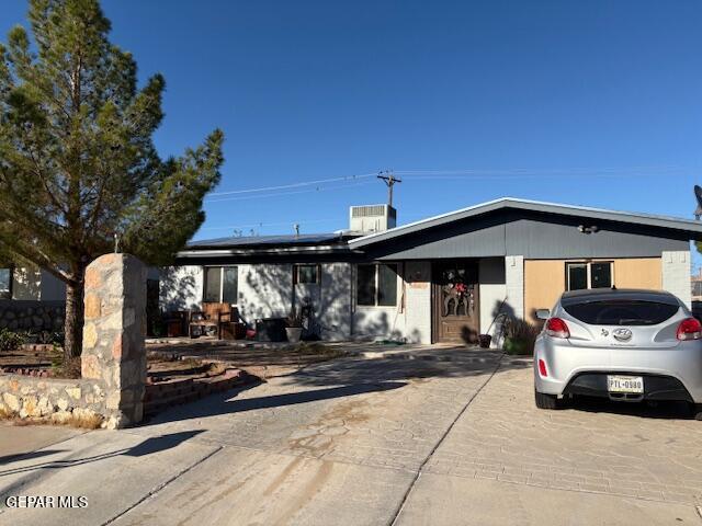 a front view of a house with parking space