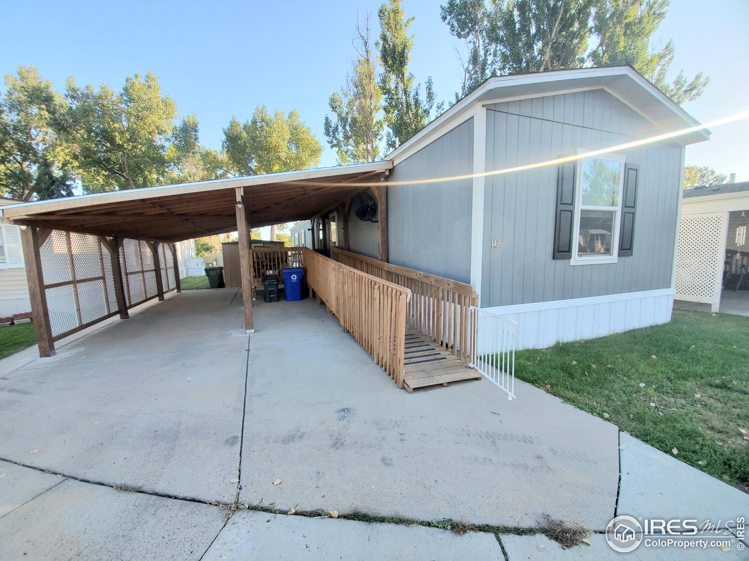 a view of backyard with deck and outdoor seating