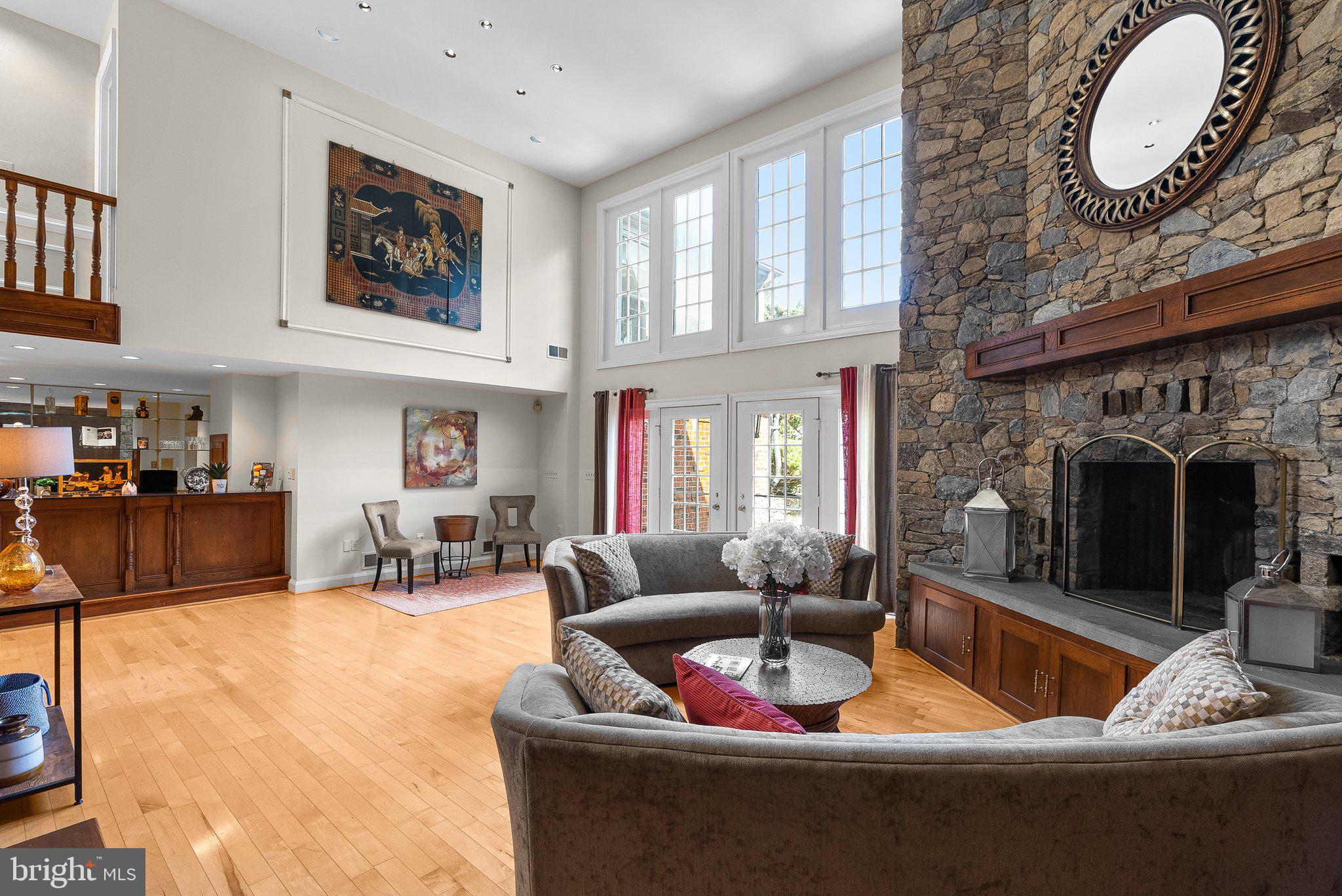 a living room with furniture fireplace and window