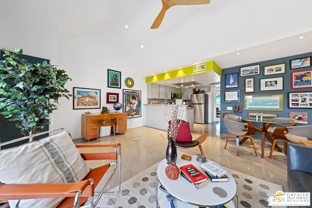 a living room with furniture kitchen and a table