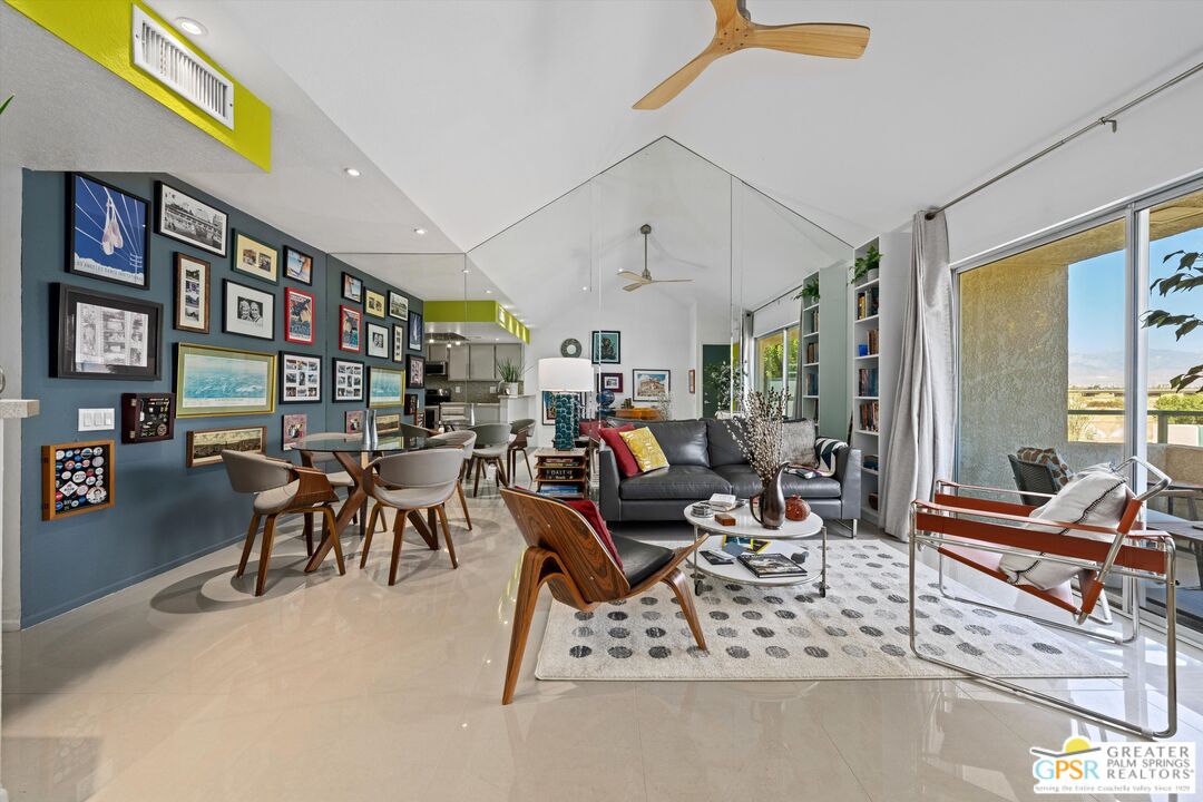 a view of a livingroom with furniture and a potted plant