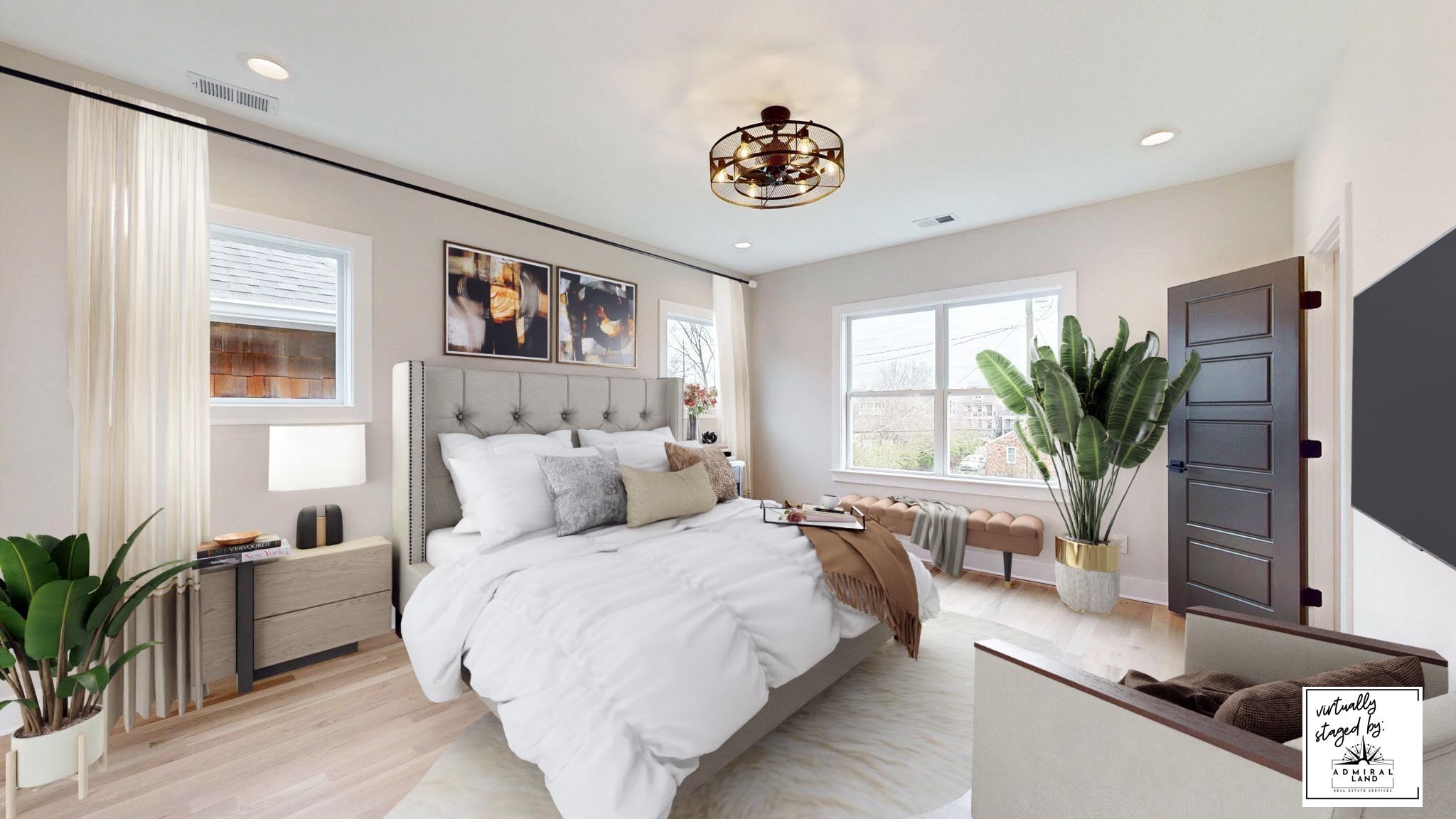 a bedroom with a large bed and a potted plant