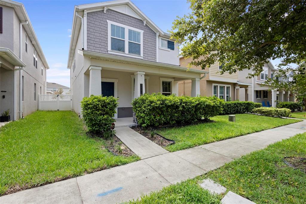 a front view of a house with a yard