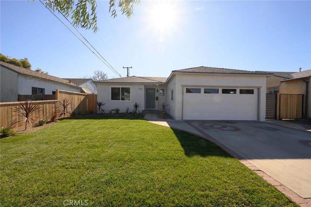 a front view of a house with yard