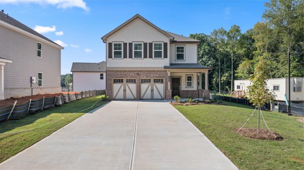 a front view of a house with a yard