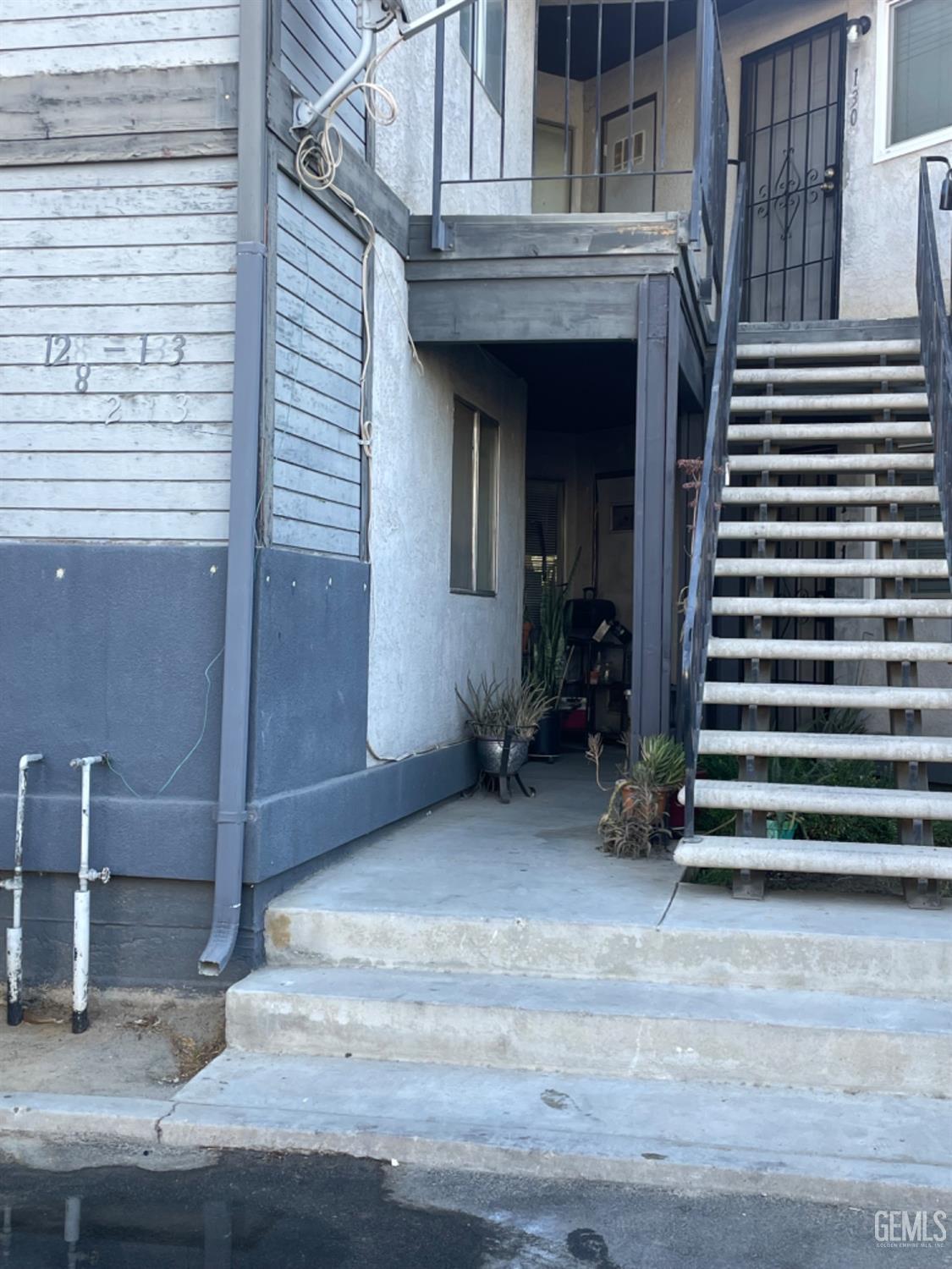 a view of a house with a door and wooden floor