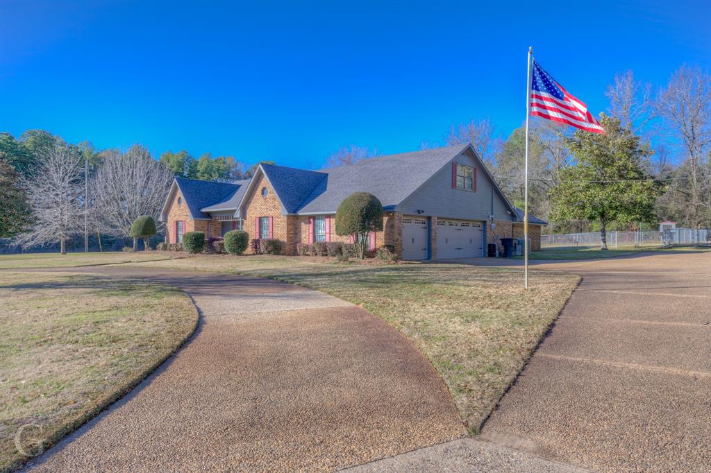 a house with yard in front of it