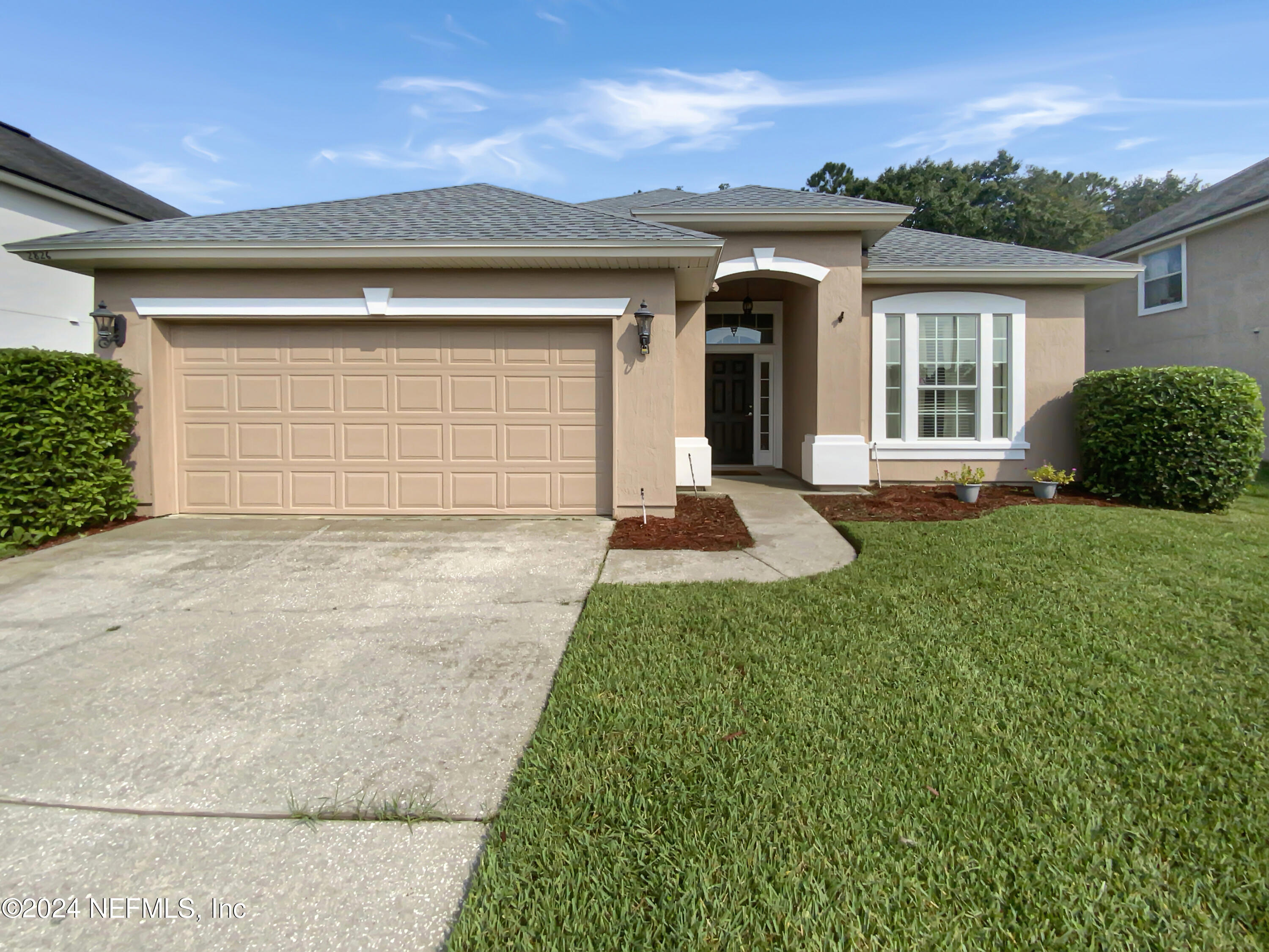 front view of a house with a yard