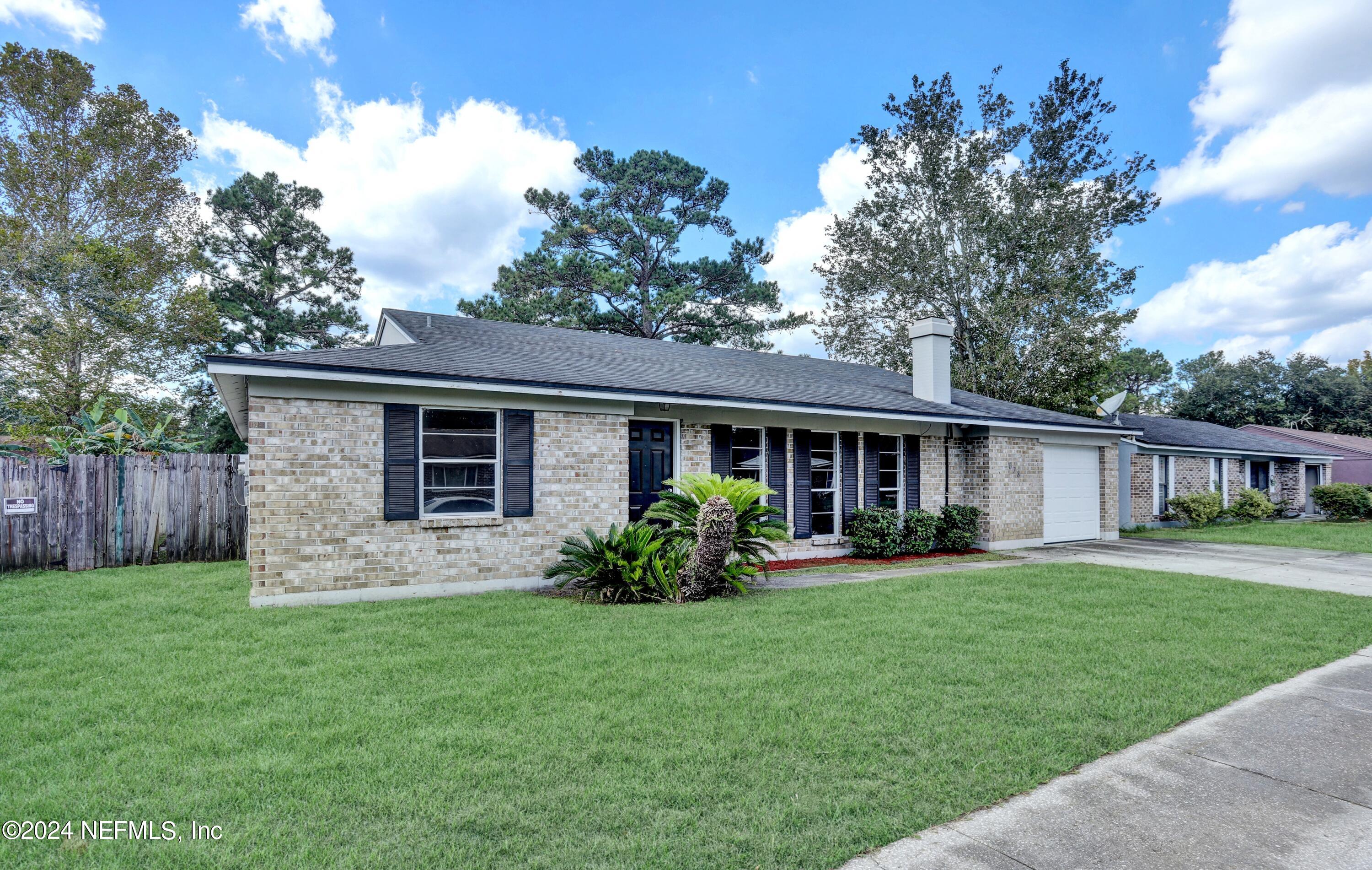 front view of a house with a yard