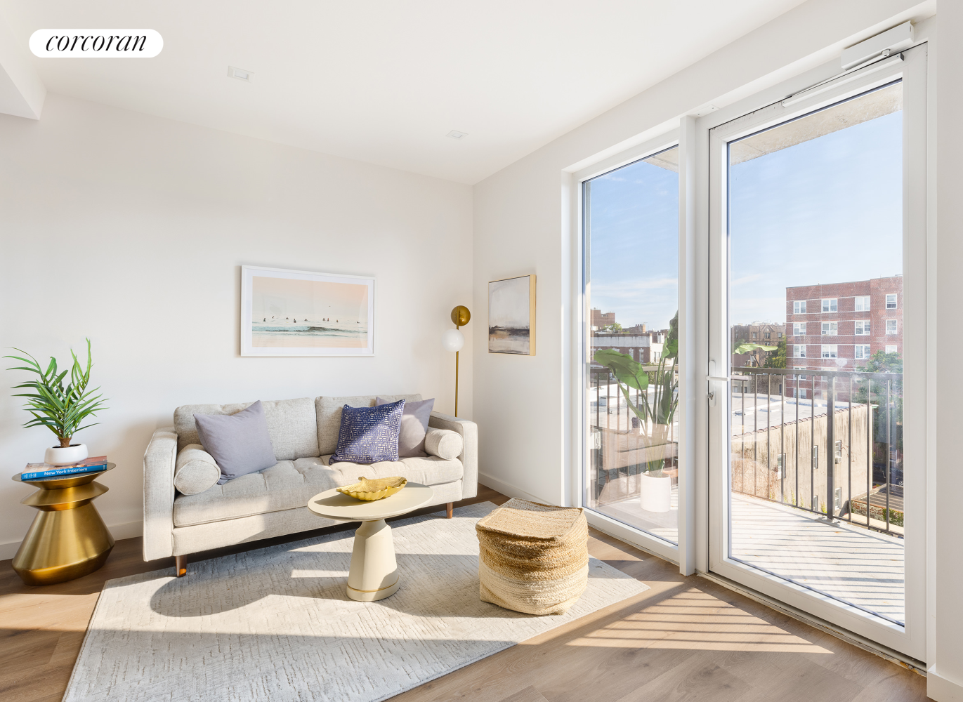 a living room with furniture and a floor to ceiling window