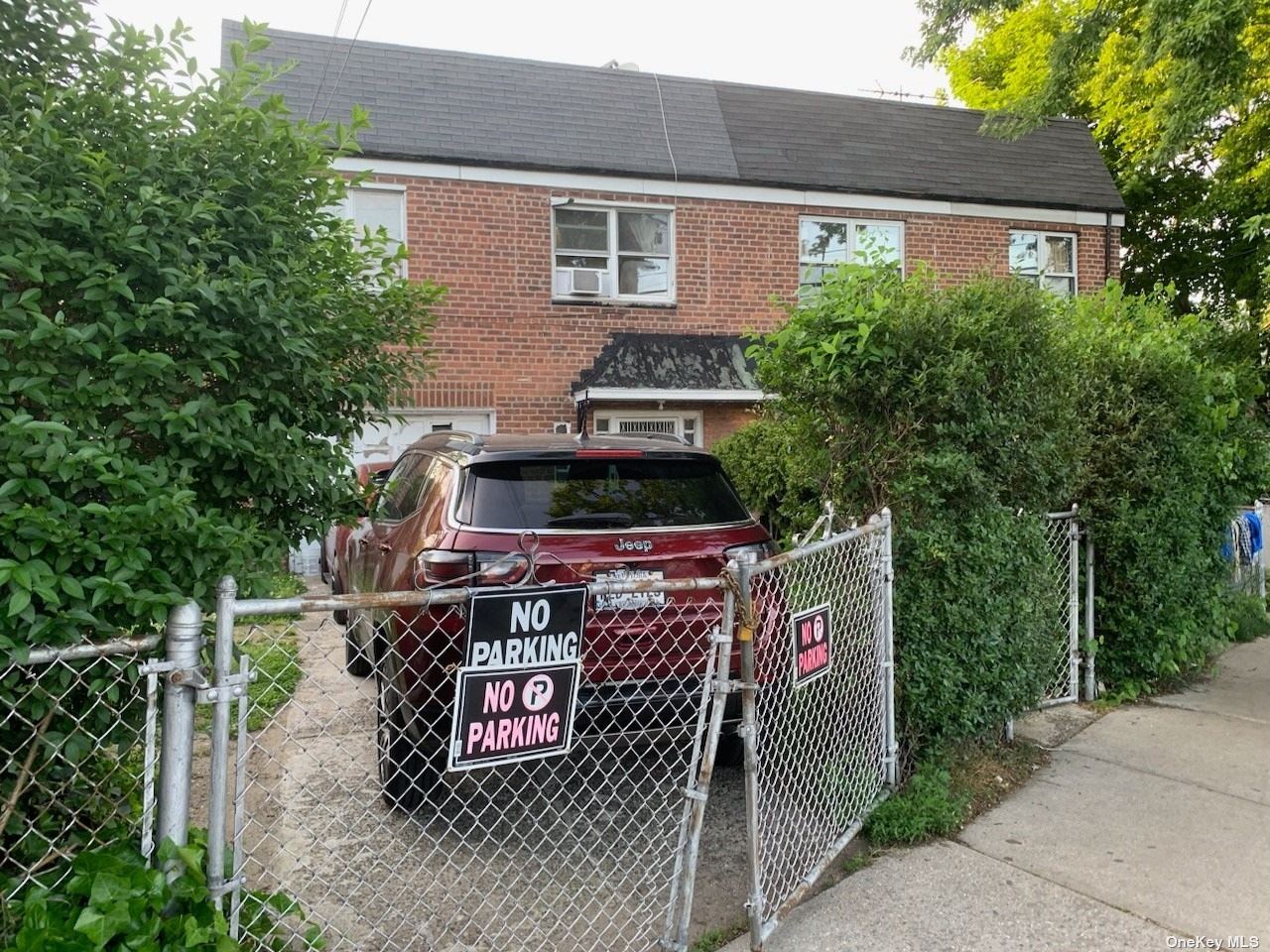 a front view of a house with a garage