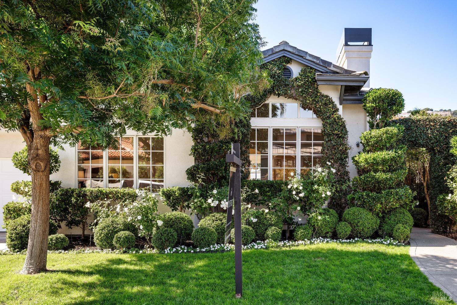 a front view of a house with a yard