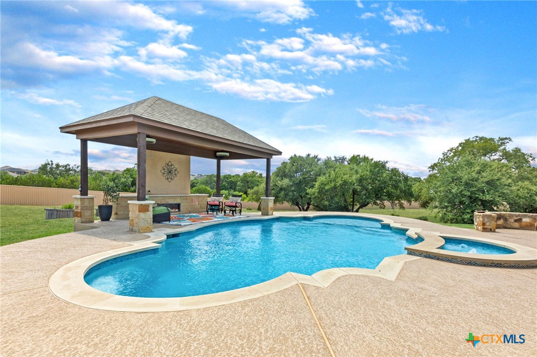 a view of a swimming pool and lounge chair