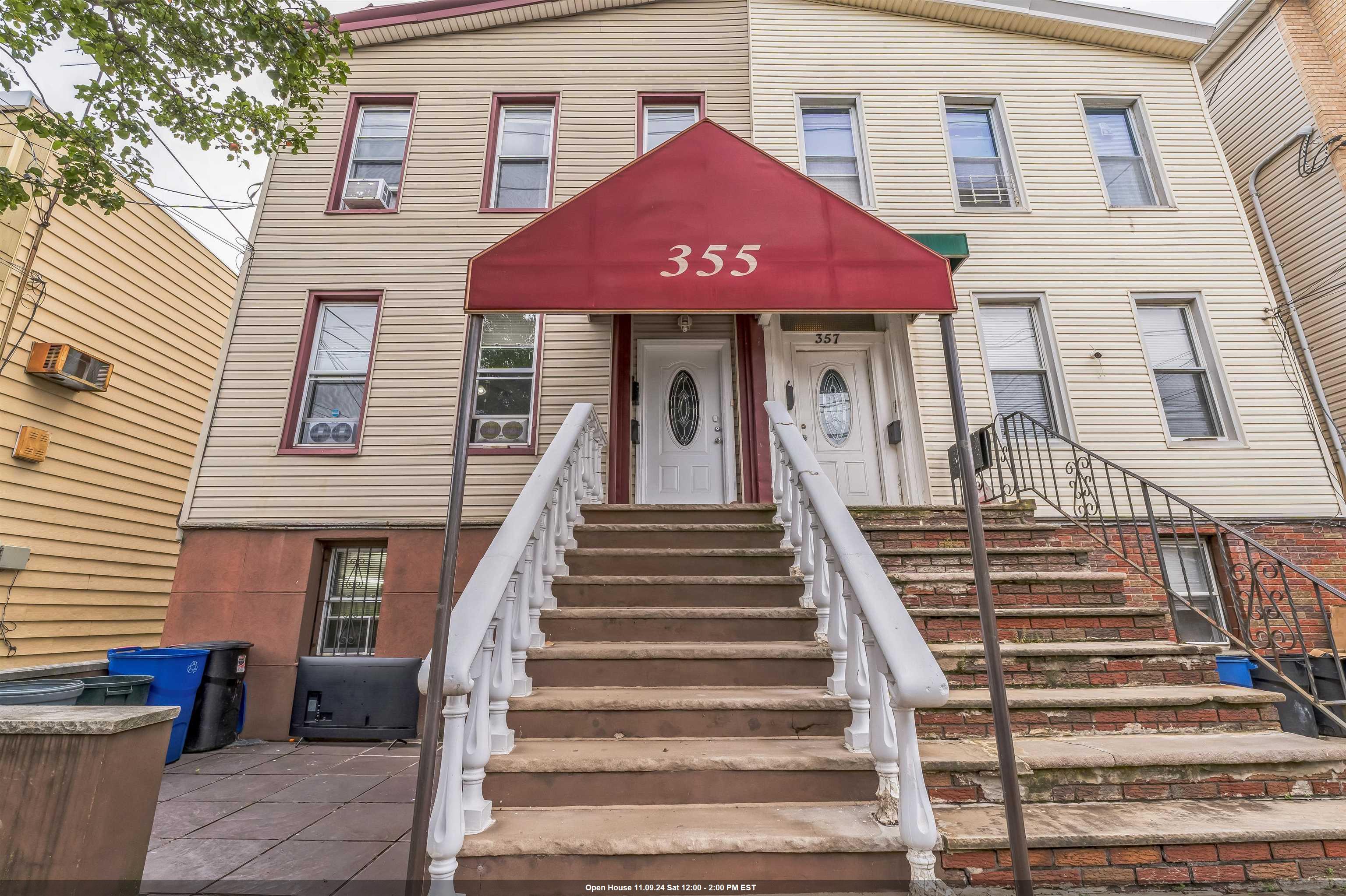 a front view of a house with a stairs