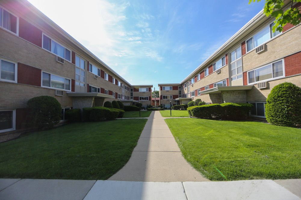 a view of a building with a yard