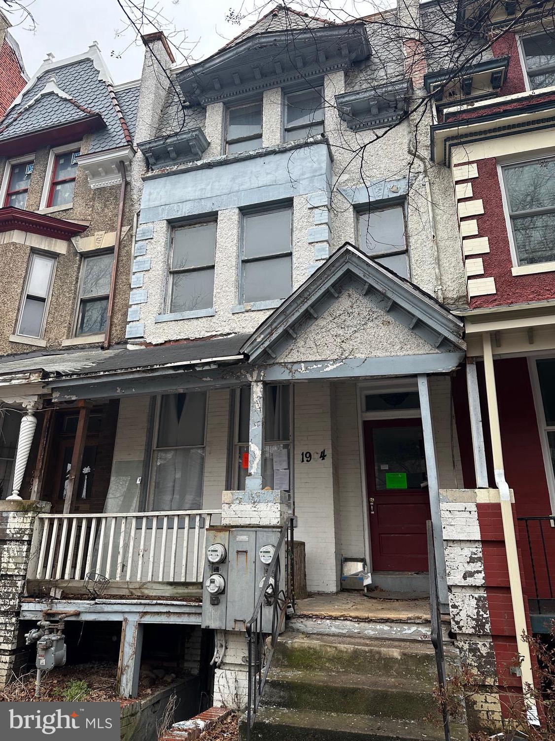 front view of a house with a small deck