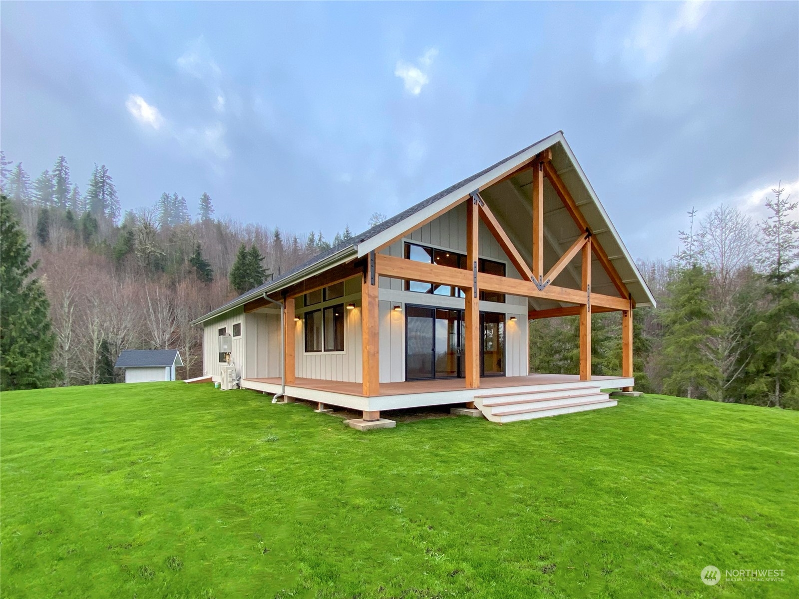 a front view of house with yard and green space