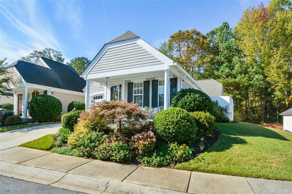 a front view of a house with garden