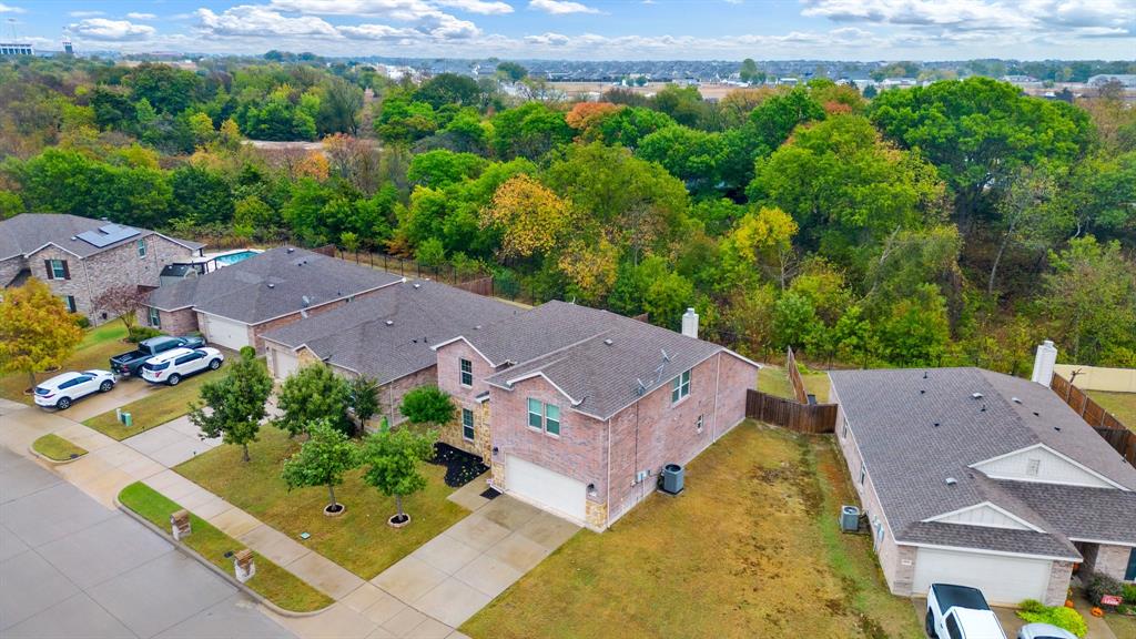 an aerial view of a house with a garden