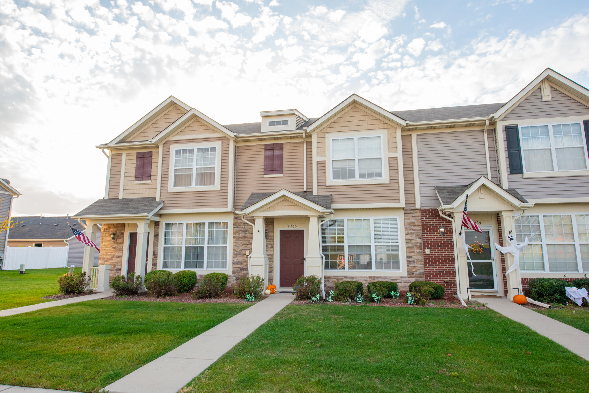 front view of a house next to a yard