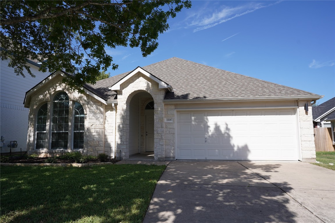 a front view of house with yard