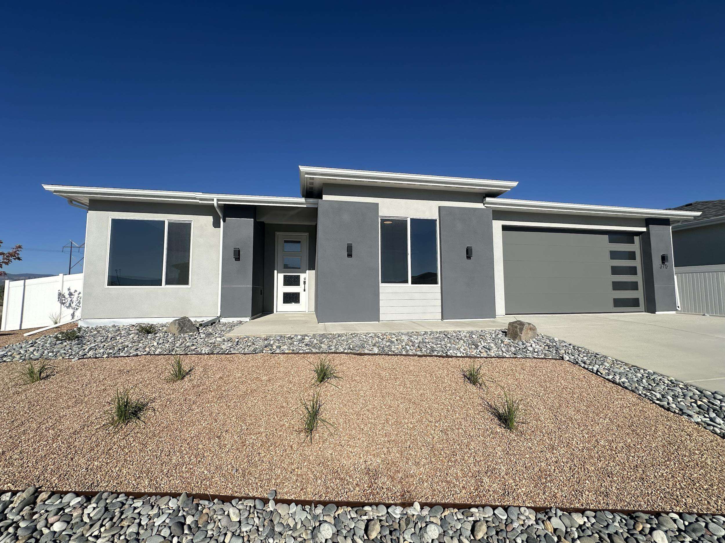 a front view of a house with a outdoor space