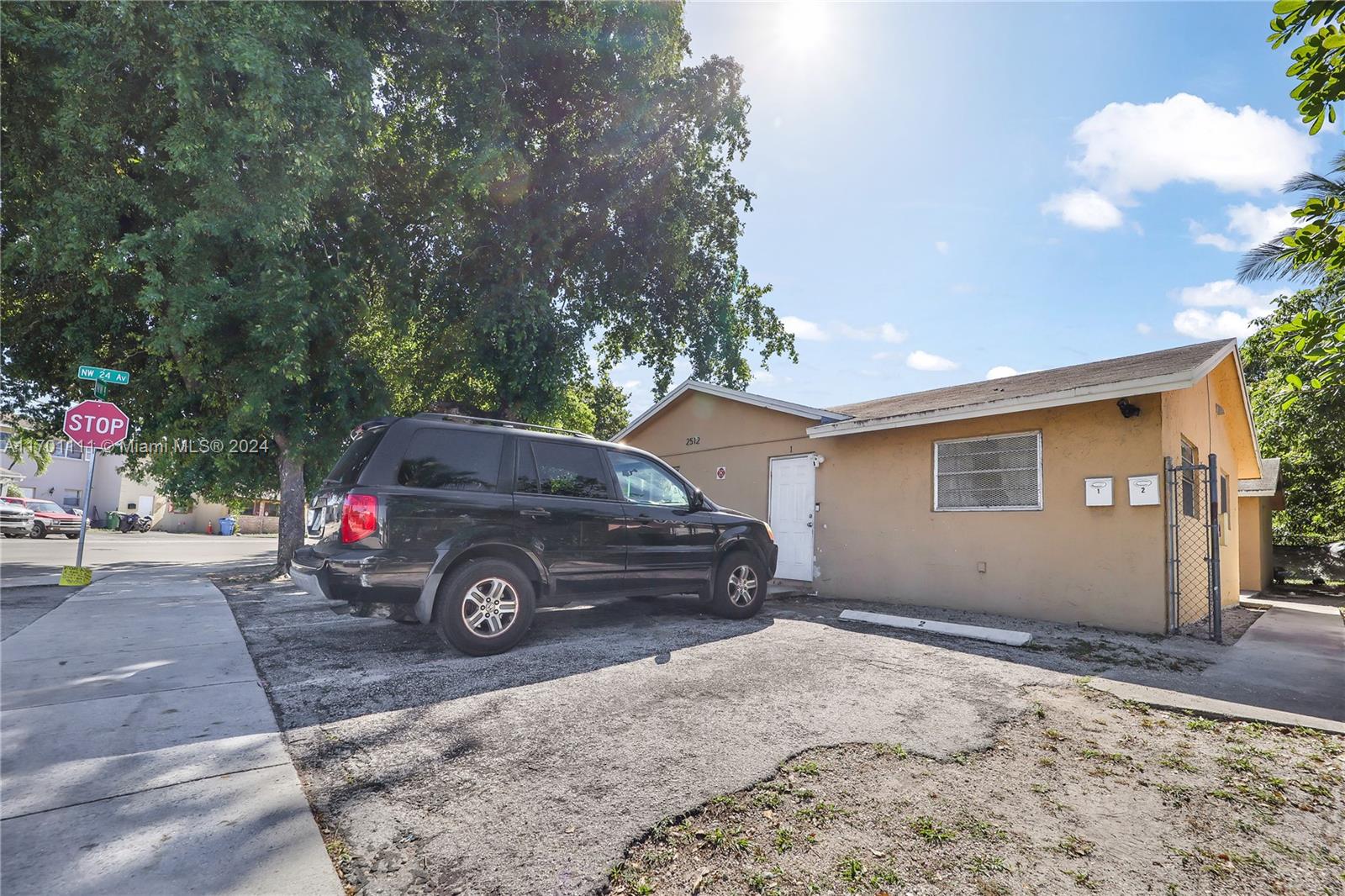 a view of a car in front of a house