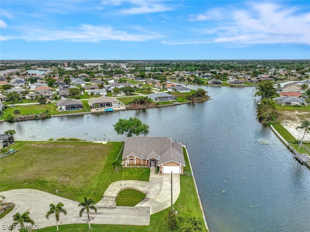 an aerial view of a house with a lake view