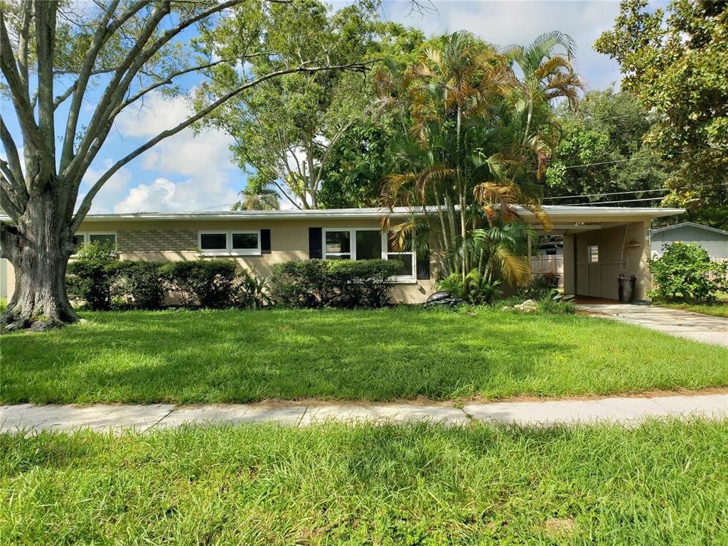 a front view of house with yard and green space