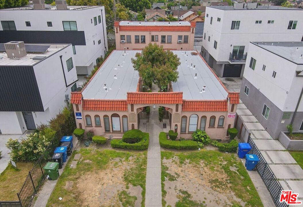 an aerial view of a house with a yard