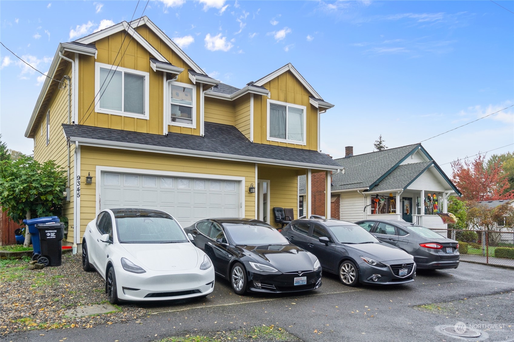 a front view of a house with parking space