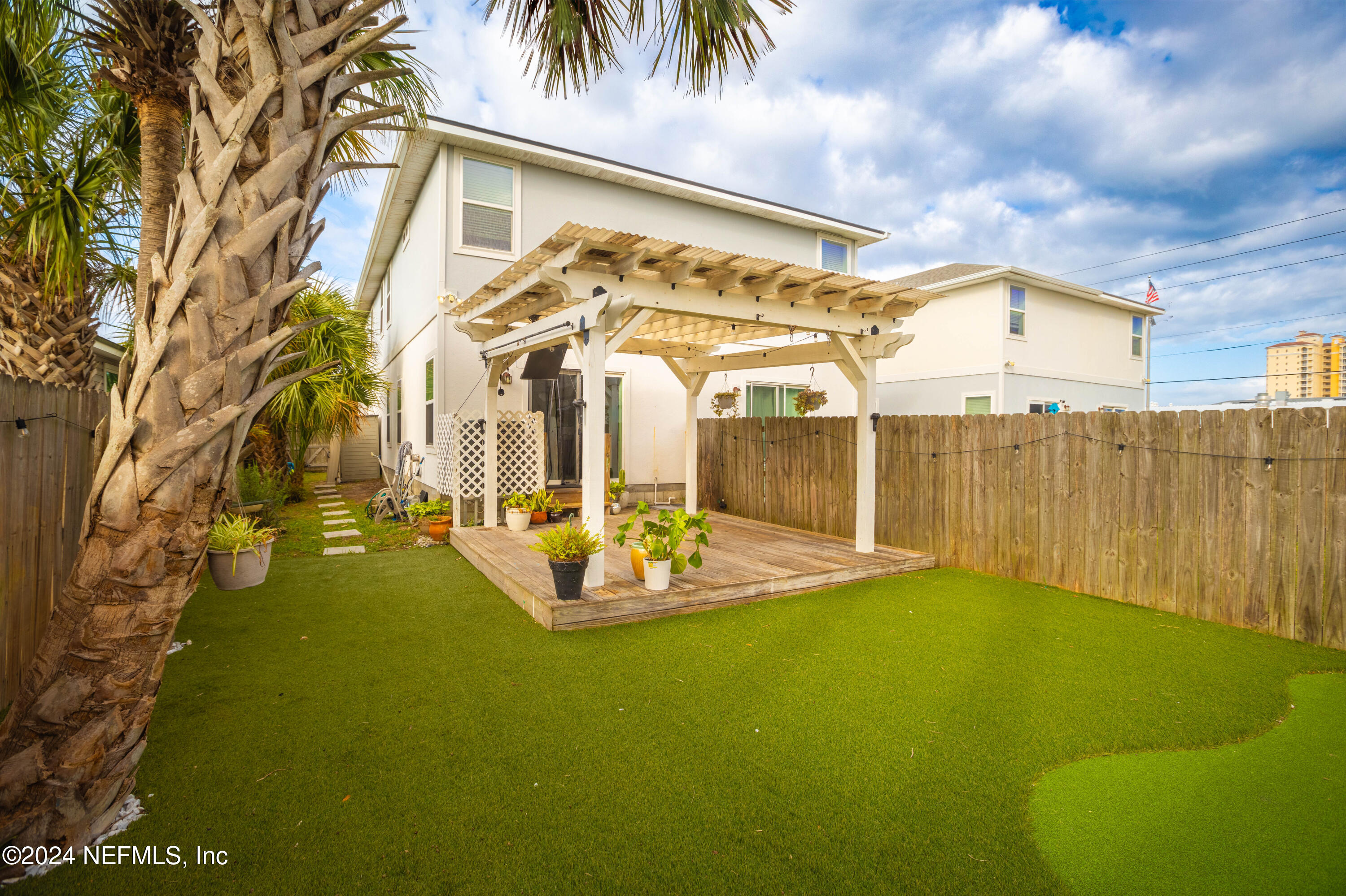 a view of swimming pool with outdoor seating and deck