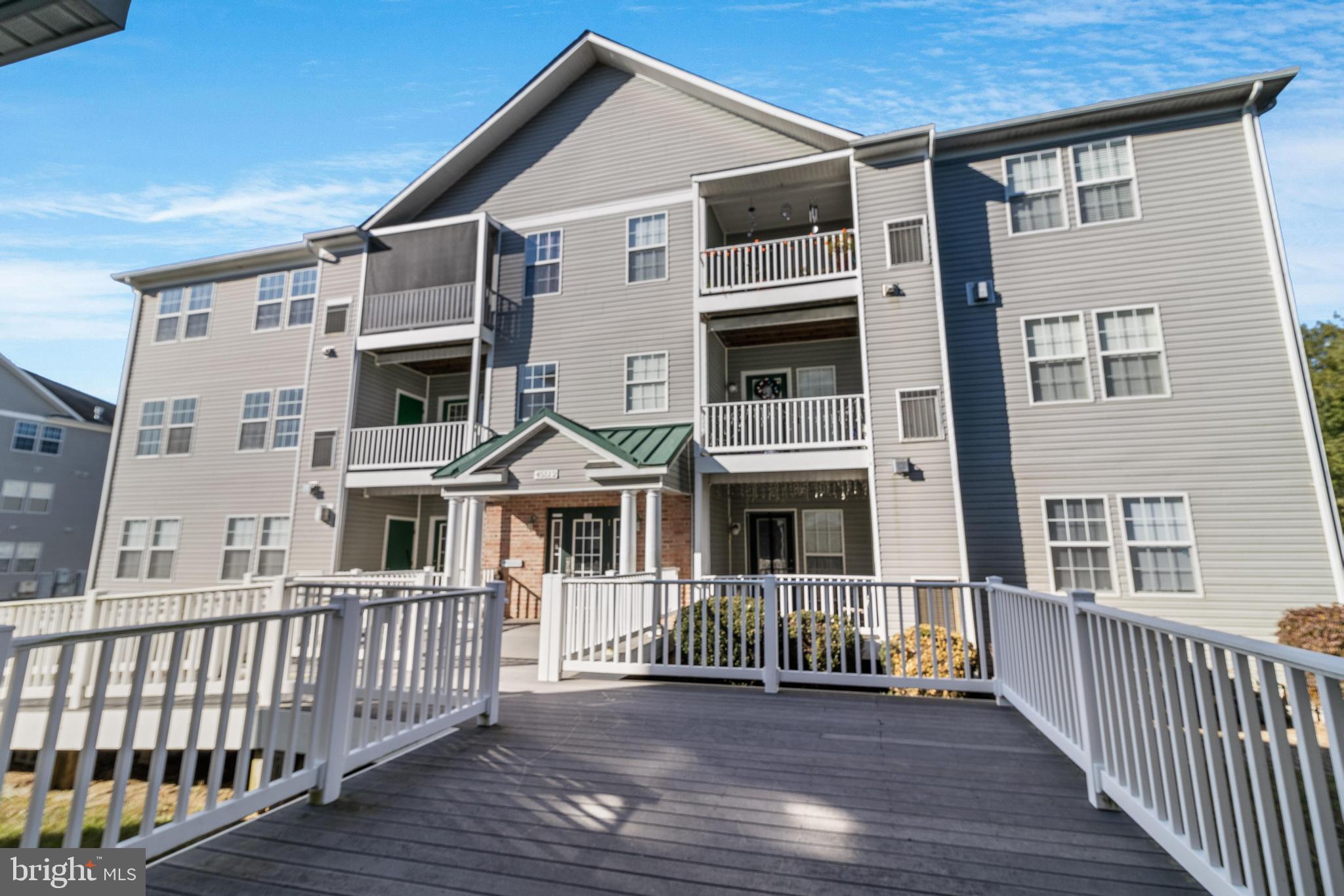 a front view of a house with deck