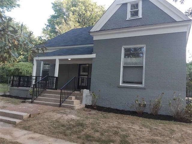 a house with trees in the background