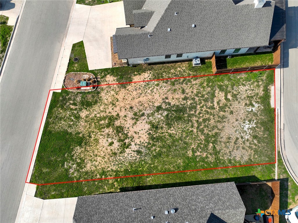 an aerial view of house with yard