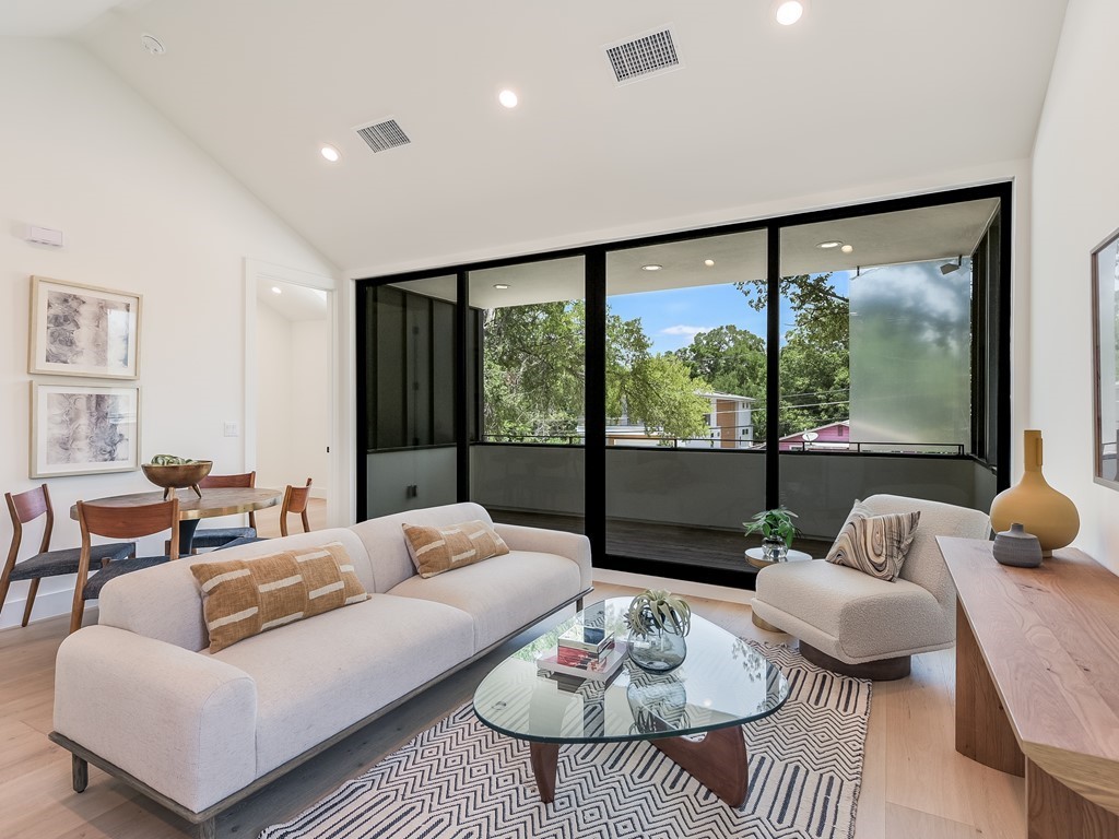 a living room with furniture and a large window