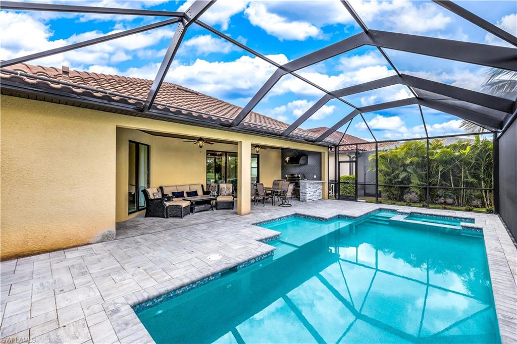 a view of swimming pool with sitting area