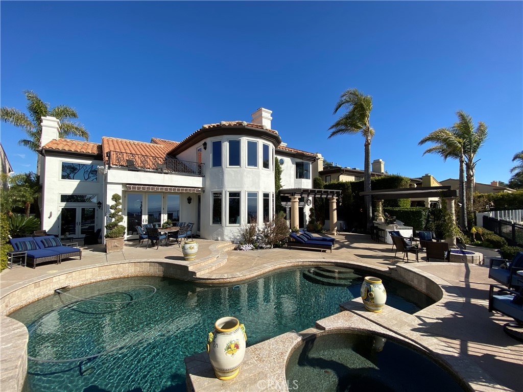 a view of a patio with swimming pool table and chairs