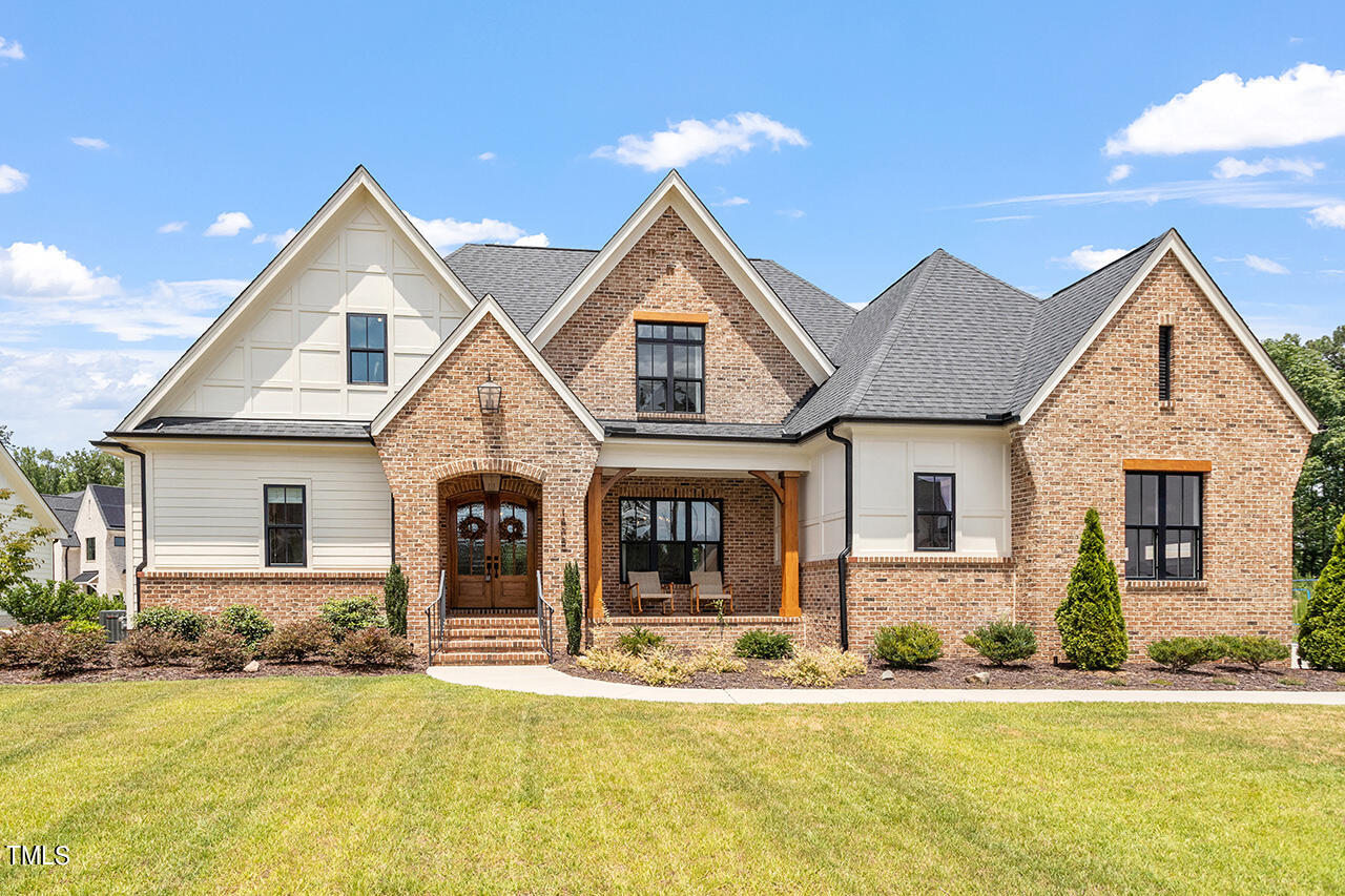 front view of a house with a yard