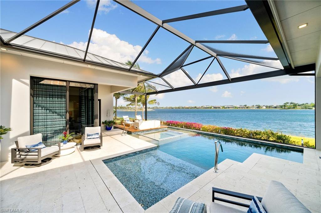 a swimming pool with outdoor seating