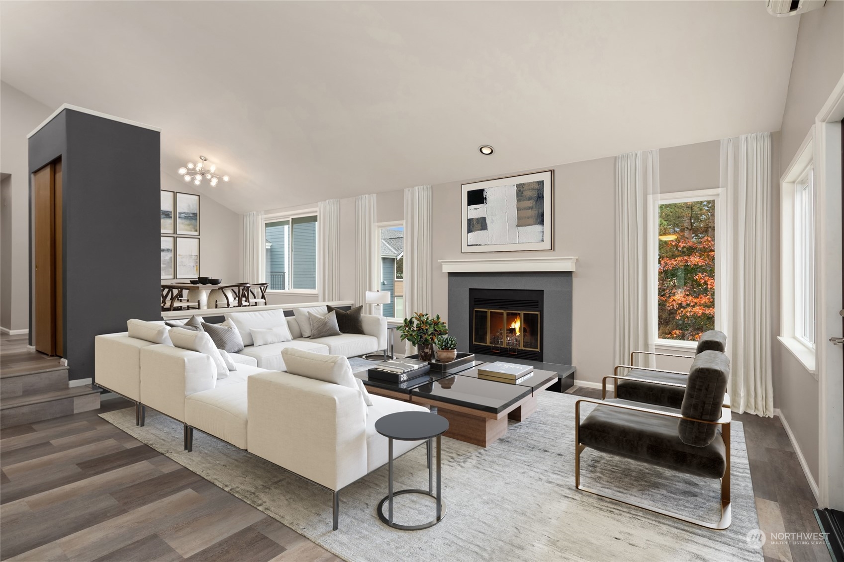 a living room with furniture a rug and a fireplace