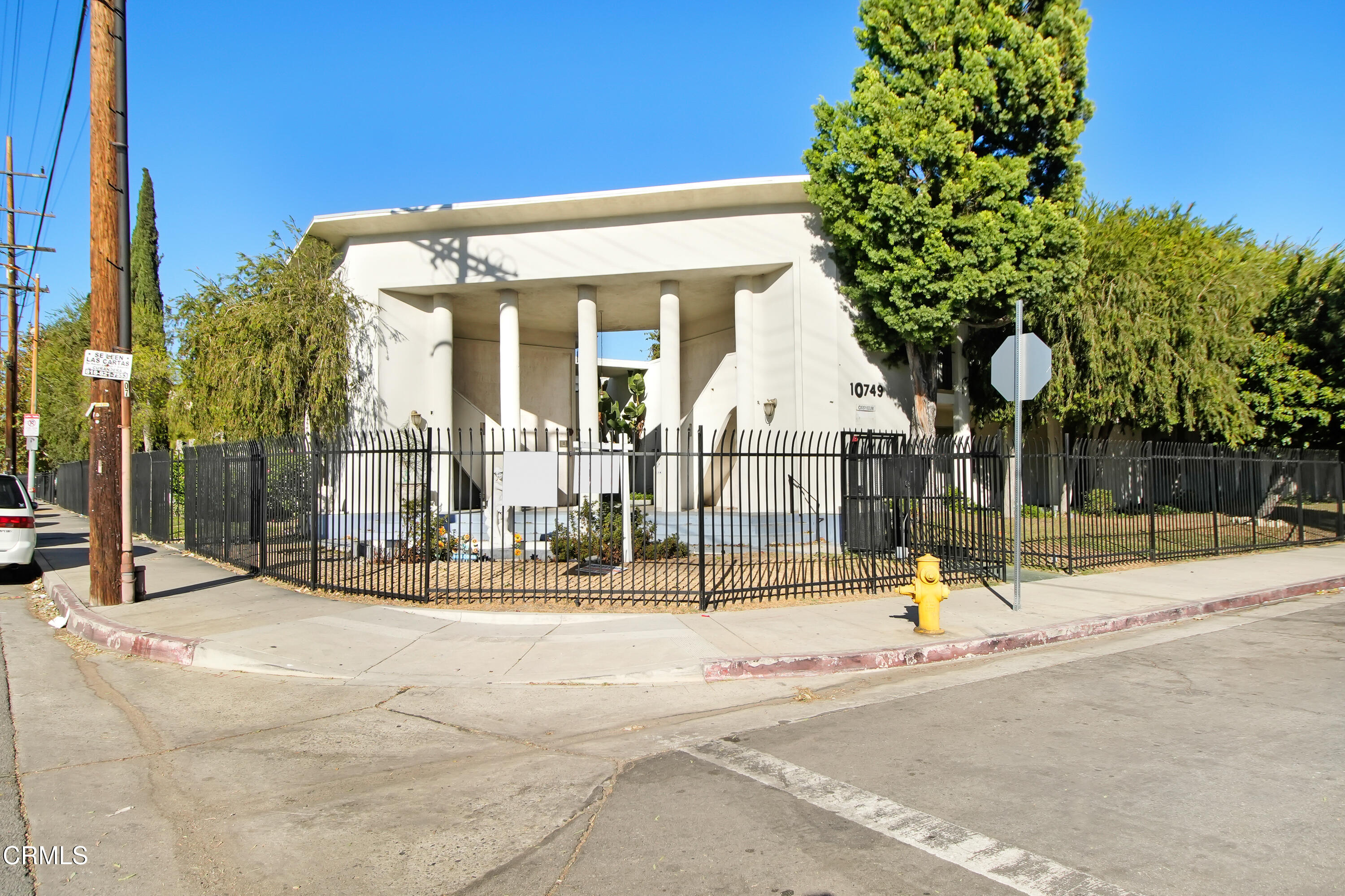 a view of parked space in front of a building