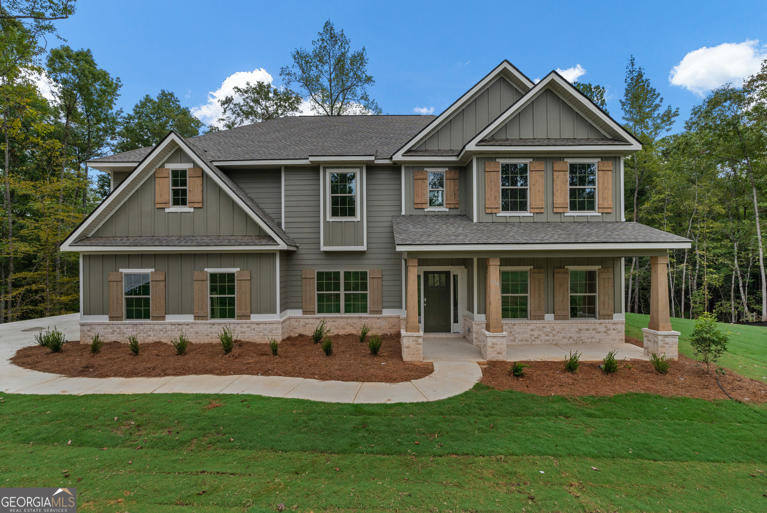 a front view of a house with a yard