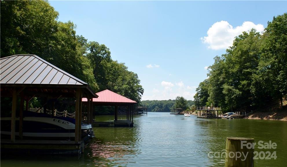 a view of house with outdoor space and lake view