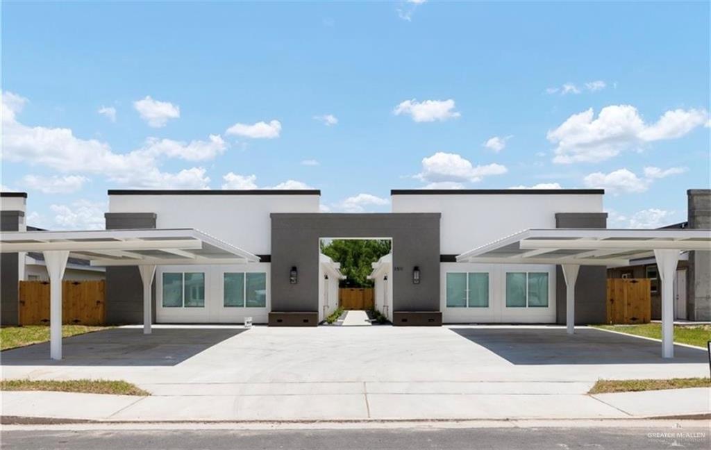 a view of a brick building next to a yard