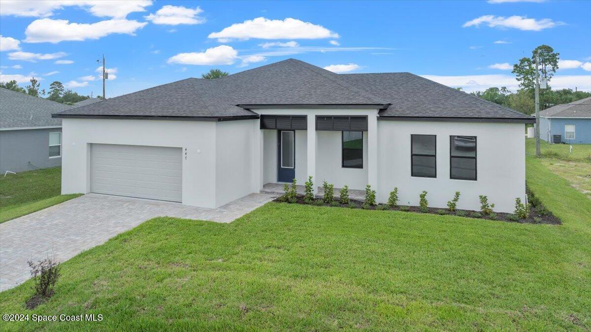 a front view of a house with a yard